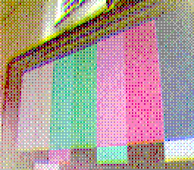 A low resolution image taken on a gameboy camera. It depicts a series of colored rectangles shown on a computer's display.